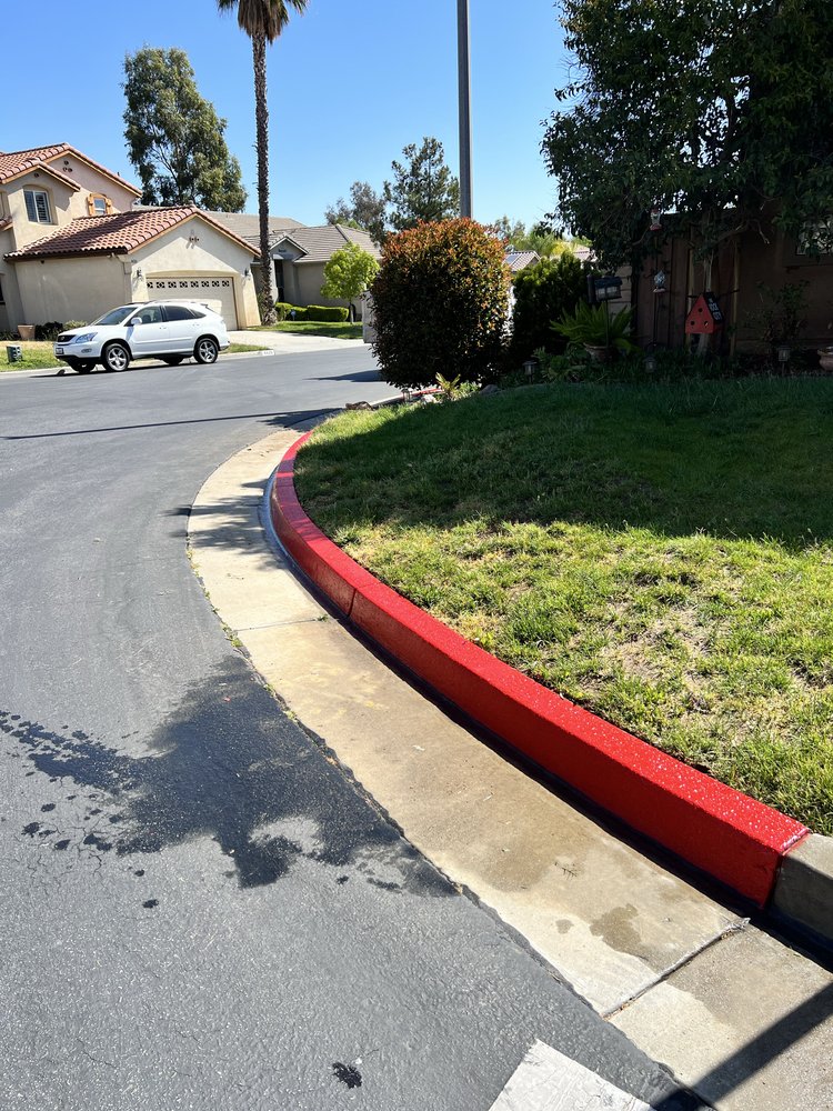 Freshly painted red curb along a neighborhood street