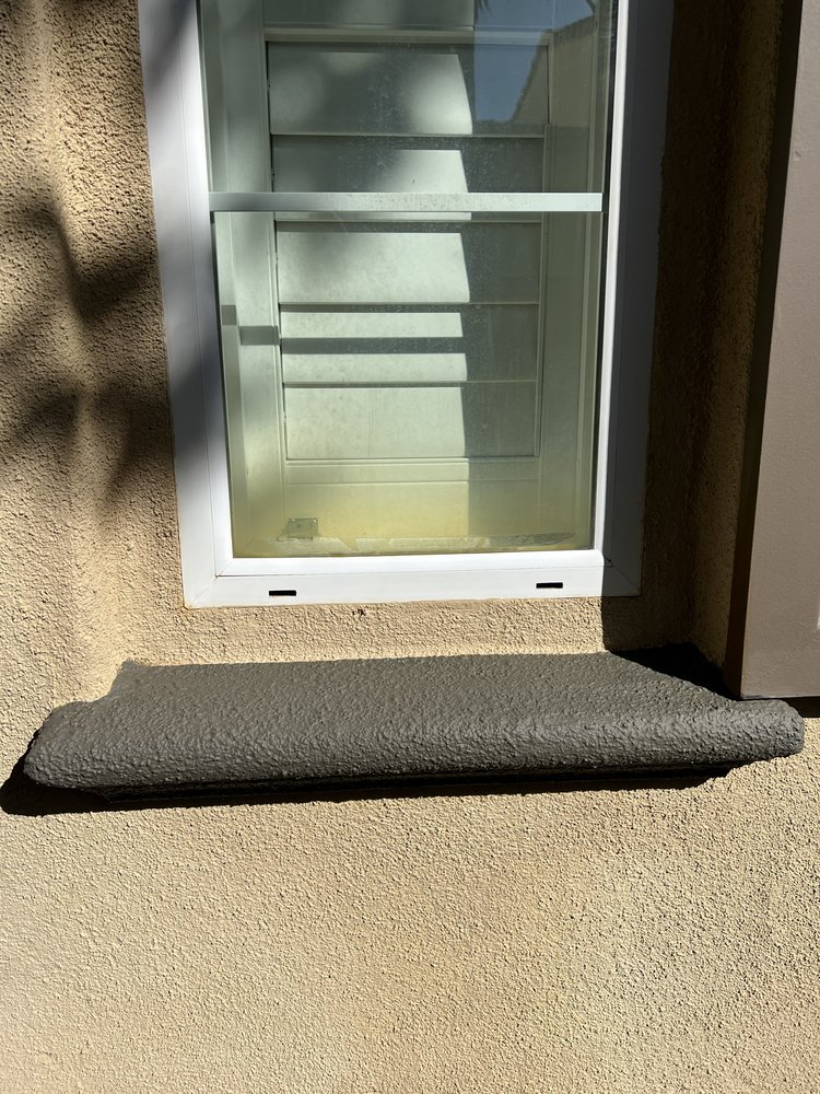 Freshly repainted home exterior and window sill