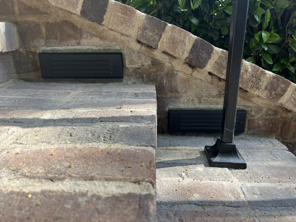 Recessed step lighting installed in brick stairs